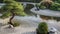 Zen Japanese Garden: a peaceful scene depicting a traditional Japanese garden with a koi pond, meticulously raked gravel