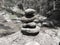 Zen meditation background, balanced piles stacked in black and white water