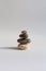 zen pebbles balancing on white background