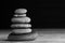 Zen sculpture. Harmony and balance, cairn, poise stones on wooden table