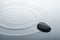 Zen stone in rippled water