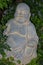 Zen stone statue of a buddha in the ornamental relaxation garden