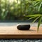 Zen Stone on Wooden Terrace: Serene Retreat. Generative AI