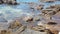 Zen stones balance at stony beach and sea background