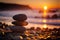 zen stones on the beach at sunset. meditation and relaxation concept.