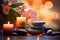 Zen stones, orchid flowers and aromatic candles spa arrangement on wooden table