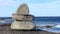 Zen stones on a rock near the atlantic ocean