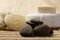 Zen stones and spa set on the wood for treatments