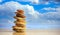 Zen stones stack on blue sky and sea background