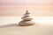 Zen stones stack on raked sand in a minimalist setting for balance and harmony