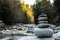 Zen stones stacked on river scene
