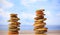 Zen stones stacks on blue sky and sea background