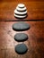 Zen stones on a weathered antique table.