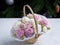 Zephyr bouquet of flowers in a basket on a light background. the concept of a New Year\'s holiday.