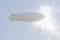 Zeppelin airship against clouds,