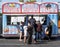 Zeppole food truck in parking lot at local street fair