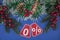 zero percents with Christmas wreath on a dark blue  background, top view, copy space, flat layout. Christmas big sale