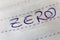 Zero spelled on lined paper