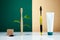Zero waste, Eco-friendly creative concept. Wooden bamboo toothbrush with leaves VS plastic brush