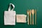 Zero waste, plastic free, eco friendly bamboo cutlery set and reusable canvas shopper bags. Sustainable lifestyle concept