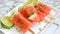 Zesty Chili Lime Watermelon Popsicle Delight Presented on a Stunning White Serving Plate --