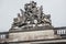 Zeughaus or Old Arsenal roof sculpture, blue sky. German Historical Museum