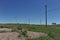 Zhambyl region, Kazakhstan - 05.15.2013 : Old power lines line the new wind turbines