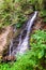 Zhenetskyi Huk waterfall in green forest. Carpathians, Ukraine