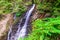 Zhenetskyi Huk waterfall in green forest. Carpathians, Ukraine