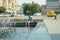 Zhytomyr, Ukraine - July 12, 2014: Old man fleeing from the heat in a city fountain in the centre