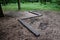Zigzag on the ground in the forest is installed wooden beam for children and athletes, as a training of physical stability, is par