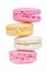 Zigzag row of sweet colorful macaroons on white background.