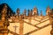 Zigzag shaped staircase of the church with numerous different statues and a cross shadow - Bom Jesus do Monte, Braga, Portugal,