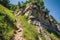 zigzag trail ascending a steep cliff face