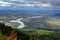 Zilina town in autumn from Mala Fatra mountain. View of the evening city from the mountains in Slovakia, dark grey storm clouds. M