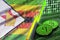 Zimbabwe flag and cryptocurrency growing trend with two bitcoins on dollar bills and binary code display