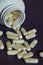 zinc in capsules. white pills. vitamin supplements. human health. background for the design