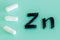 Zinc. capsules and the written chemical formula Zn, Strengthening of immunity