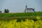 Zion Lutheran Church and graveyard near Kyle, Saskatchewan with a canola and lentil field