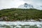 Zodiac boats from Ventus Australis expedition ship transfer tourists on the shore near Pia glacier in Patagonia