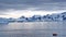 Zodiac among icebergs in a bay in Antarctica