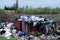 Zolotonosha, Ukraine - May 3 2021. Contamination of nature with human waste. Garbage containers with trash. Overflowing trash cans