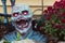 Zombie emerges from a home garden - Halloween decor