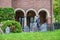 Zombies-Halloween scene set up in yard outside residential home with tombstones and skeleton bride and groom