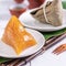 Zongzi - alkaline Chinese rice dumpling crystal food on a plate to eat for traditional Dragon Boat Duanwu Festival concept, close