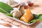 Zongzi - alkaline Chinese rice dumpling crystal food on a plate to eat for traditional Dragon Boat Duanwu Festival concept, close