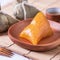 Zongzi - Alkaline rice dumpling - Traditional sweet Chinese crystal food on a plate to eat for Dragon Boat Duanwu Festival