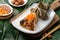 Zongzi. Rice dumpling for Dragon Boat Festival on green leaf background with ingredient