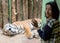 Zoo visitors watching a tiger