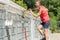 Zookeeper woman working on cleaning cage in animal shelter